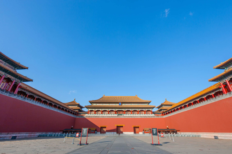 Meridian Gate seen across the entry courtyard with red walls framing the approach.